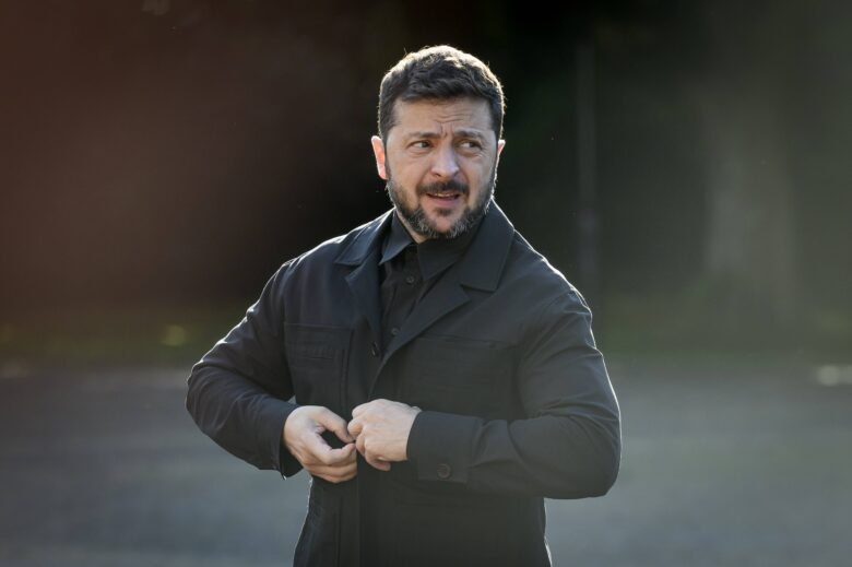 Photo of Ukrainian President Volodymyr Zelensky arriving at The Hague in the Netherlands wearing a black suit.