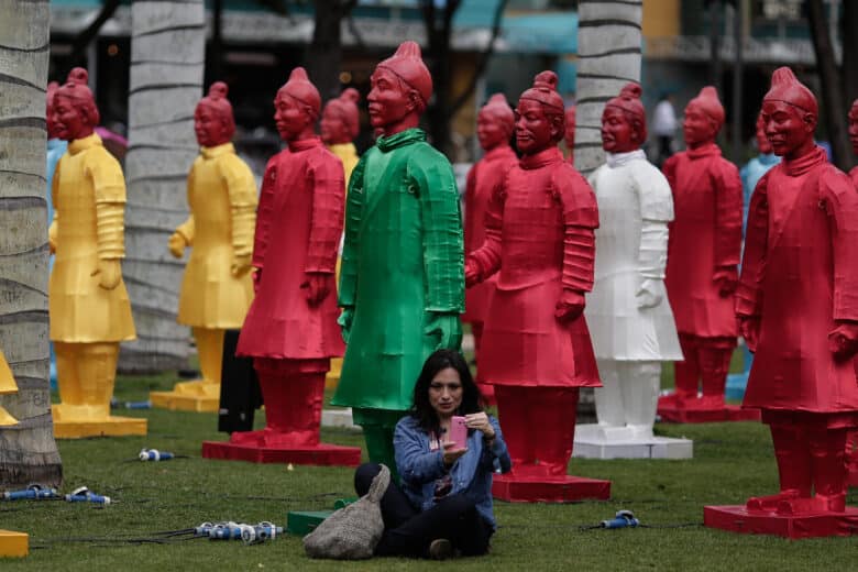 A woman takes a selfie with lanterns in the shape of Chinese Terracotta Warriors during an exhibition in Bogota, Colombia, on March 13, 2016. The exhibition was part of the XV Iberoamerican Theater Festival of Bogota.