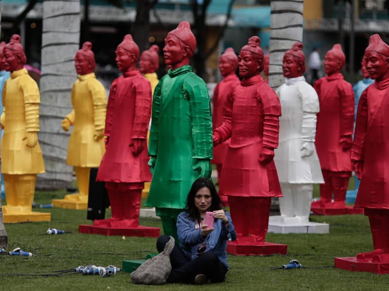A woman takes a selfie with lanterns in the shape of Chinese Terracotta Warriors during an exhibition in Bogota, Colombia, on March 13, 2016. The exhibition was part of the XV Iberoamerican Theater Festival of Bogota.