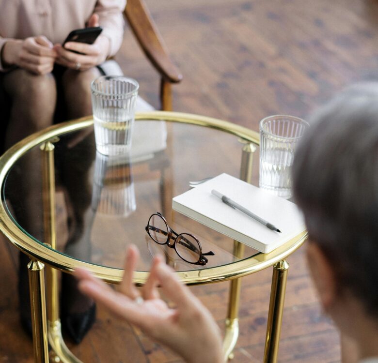 therapist and patient across a table