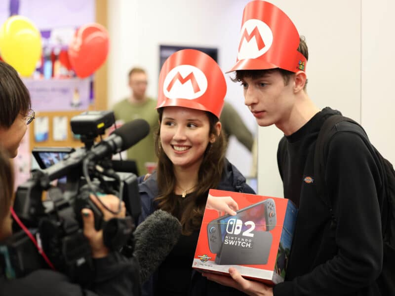 People in London collect their long-awaited Nintendo Switch 2 console, which launched worldwide on Wednesday with stores opening at midnight to accommodate record-breaking pre-orders. While some gaming fans may be deterred by the 9.99 price tag, others are eager to experience upgrades like better graphics, more storage and the new Mario Kart World game. Analysts see the Switch 2 as a strategic shift for Nintendo, offering familiar branding with appealing improvements like more support for third-party games, which could help it compete more directly with Sony and Microsoft.