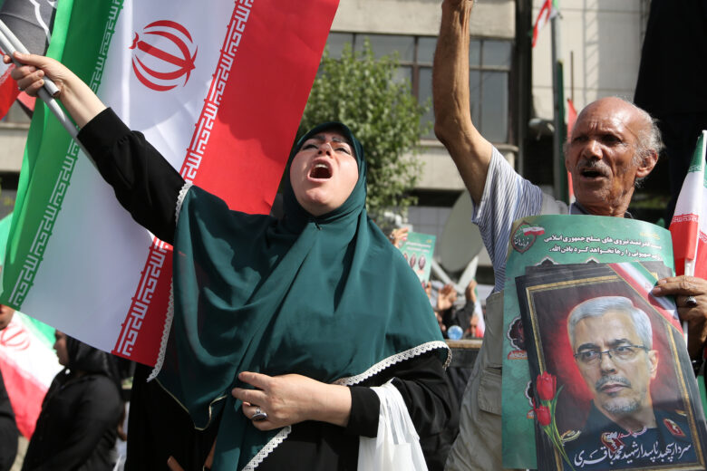 photo of iranian woman and flag