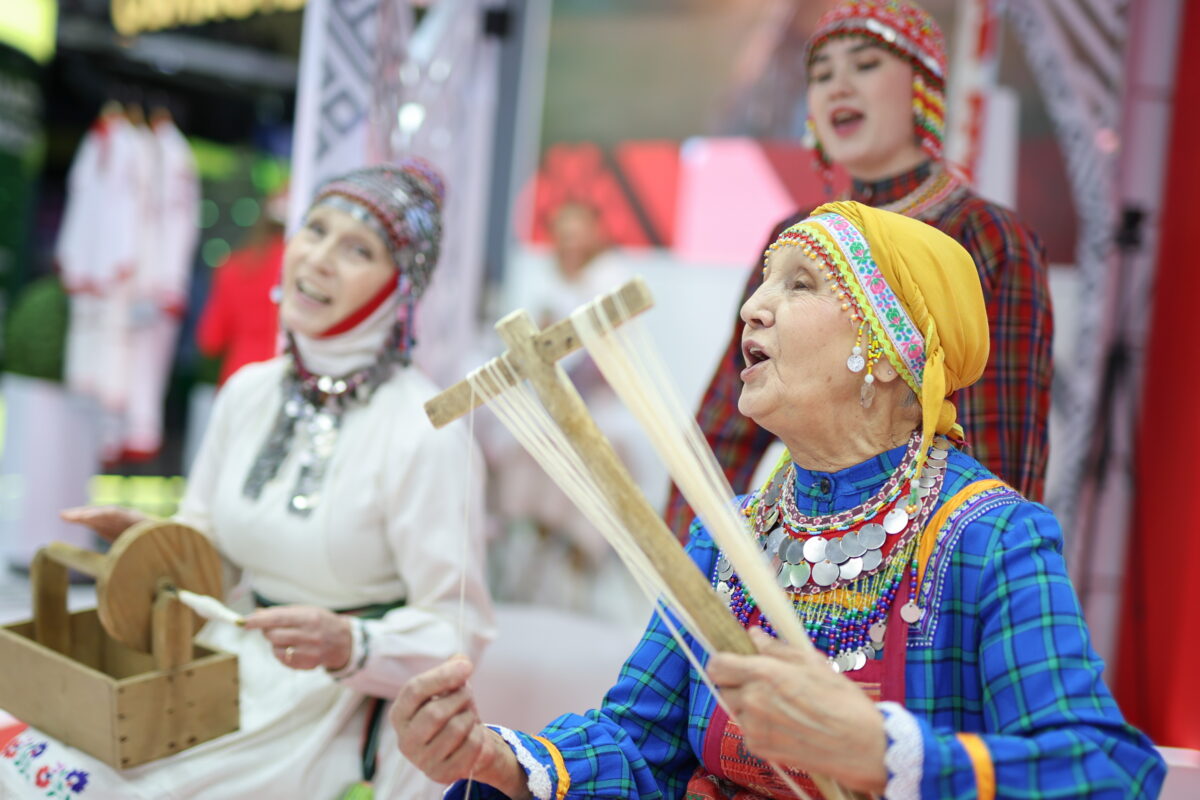 Women in folk costume at the Russia Expo international exhibition in Moscow on November 16, 2023.