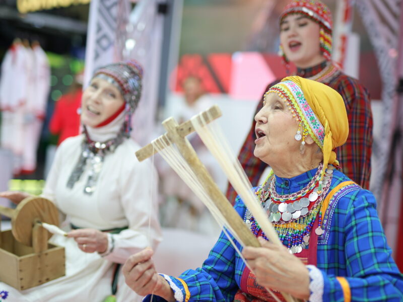 Women in folk costume at the Russia Expo international exhibition in Moscow on November 16, 2023.