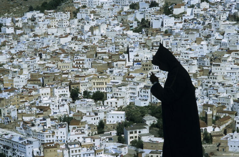 A farmer with the Medina in the background in Chefchaouen, Morocco, 2009.