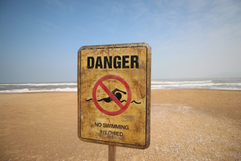 Sign fordbidden swimming on a beach