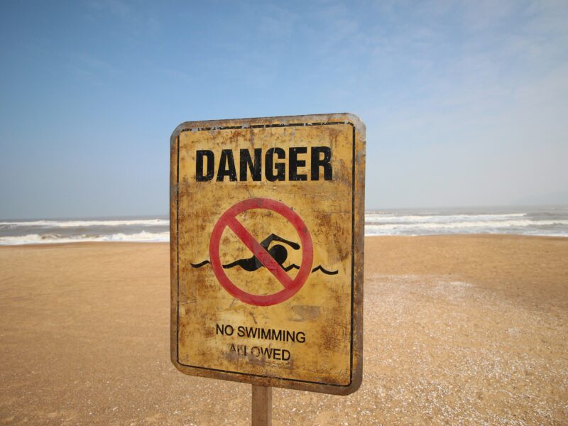 Sign fordbidden swimming on a beach