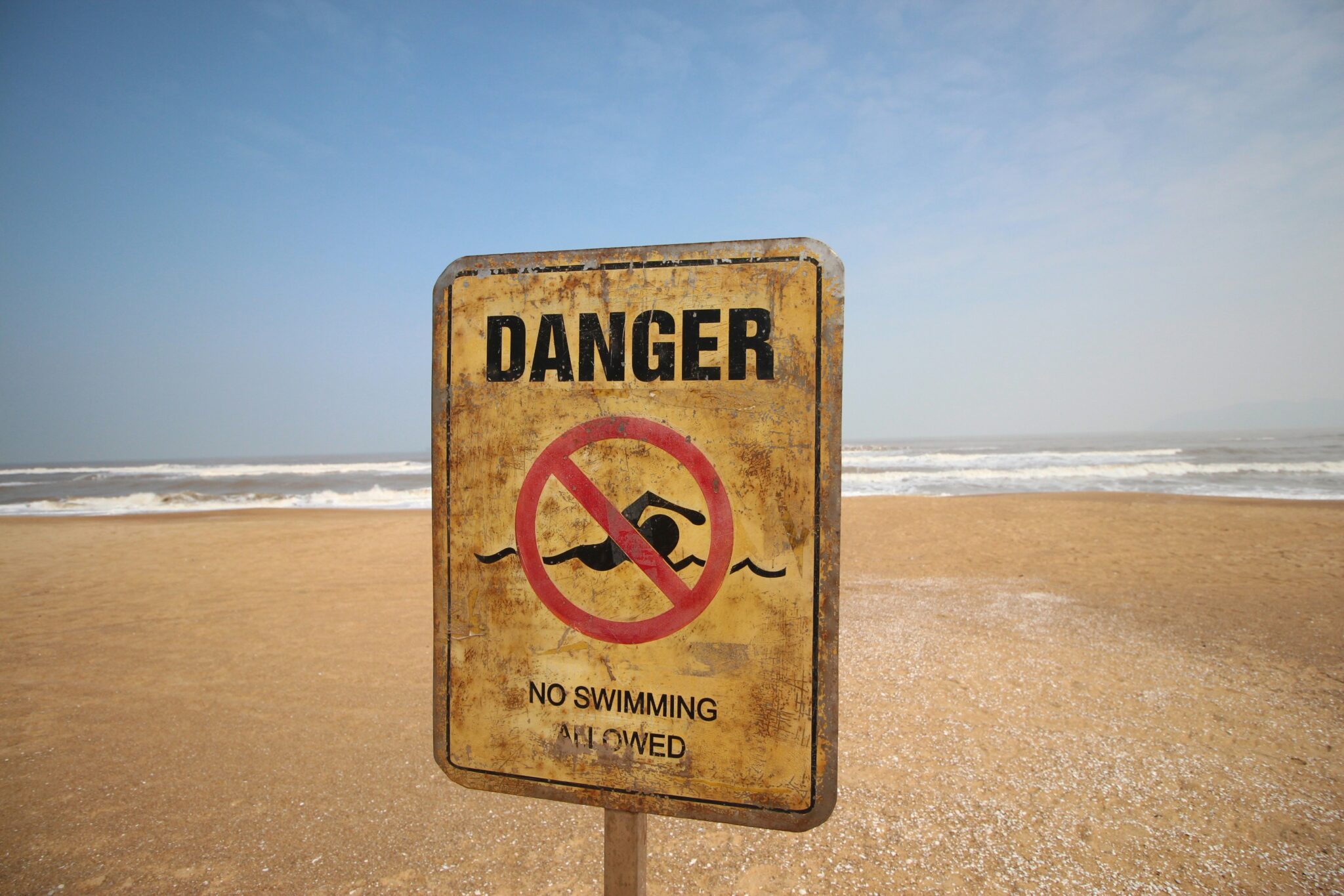 Sign fordbidden swimming on a beach