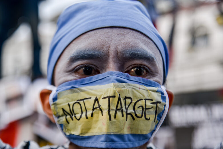 A pantomime artist dressed as a paramedic is seen at a solidarity rally for Palestine in Bandung, Indonesia, over the weekend. The protesters urged the end to the attacks launched by the Israel Defense Forces (IDF) and the immediate liberation of Palestine.