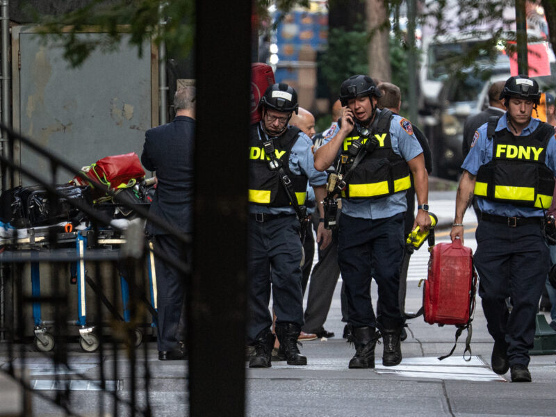 New York firefighters respond to an active shooting in midtown Manhattan on Monday, after a gunman identified as Shane Devon Tamura, 27, walked into a Park Avenue corporate building and opened fire, killing four people, including a policeman, and then shot and killed himself. Law enforcement officials believe the suspect acted alone.