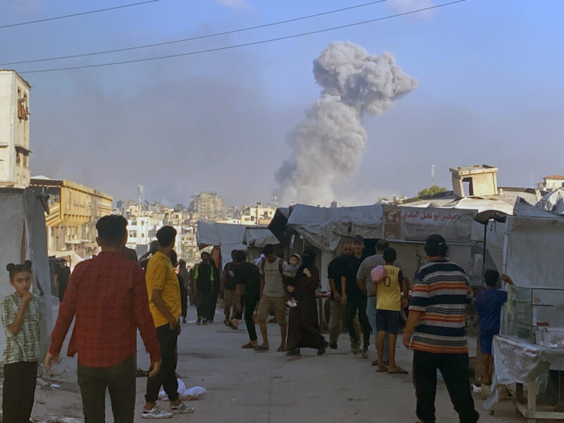 Smoke billowing in the aftermath of an Israeli strike on a house in Eastern Gaza City late Wednesday. Israeli attacks have continued throughout the night, killing at least 94 Palestinians, including 45 aid seekers, since dawn on Thursday.