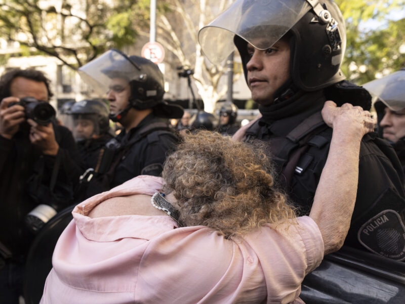A woman pleads with a police officer during a mobilization demanding increased pension income and access to medicines in Buenos Aires, Argentina. Retirees and supporters have been holding weekly protests in the capital against libertarian President Javier Milei’s austerity measures, launched shortly after he took office in December 2023.
