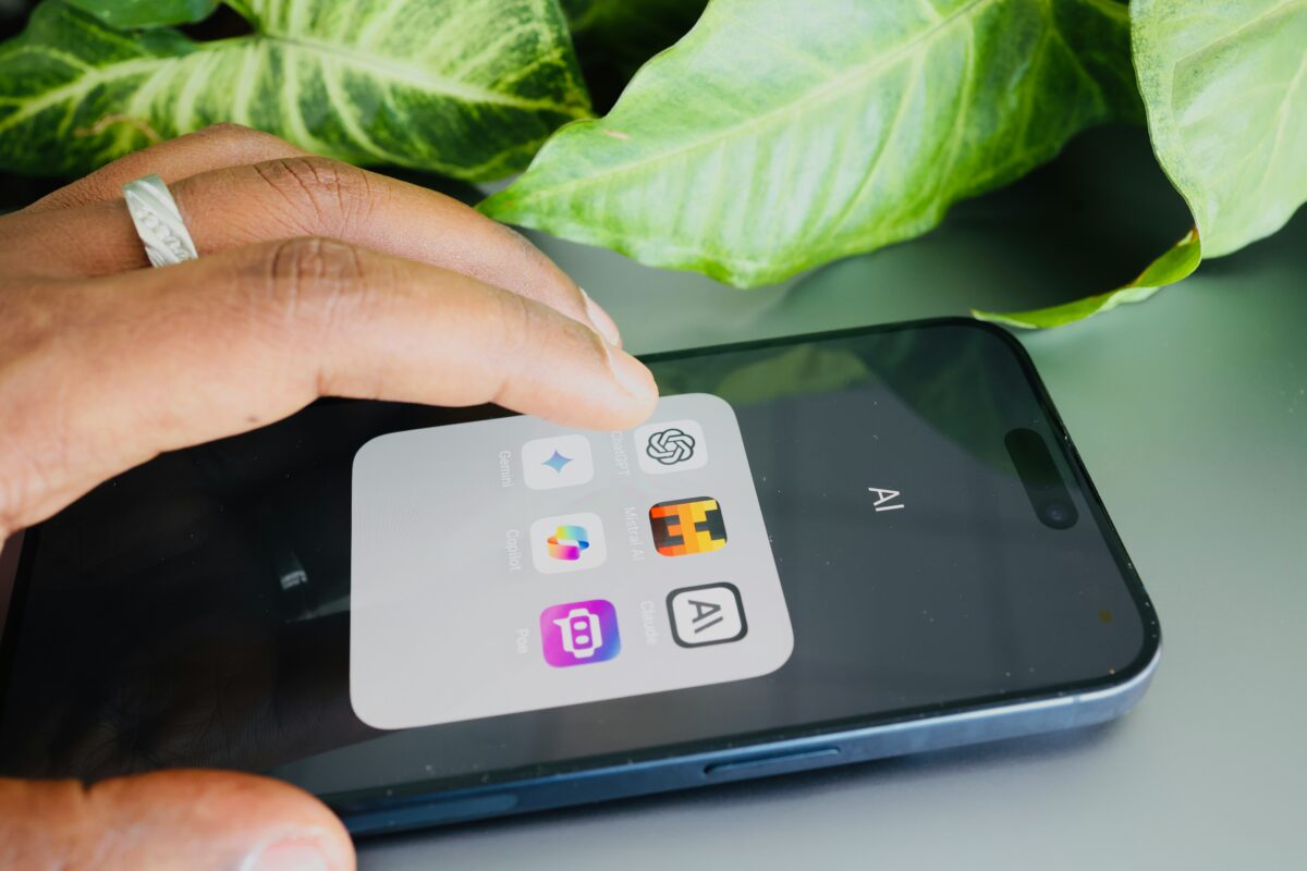 Photo of a person using AI on a phone.