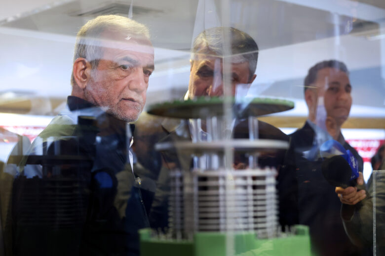 Photo of Iranian President Masoud Pezeshkian and the head of the atomic organization Mohammad Eslami.