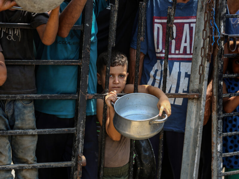 Aug. 11, 2025, Displaced Palestinians wait to get food in the west of Gaza City