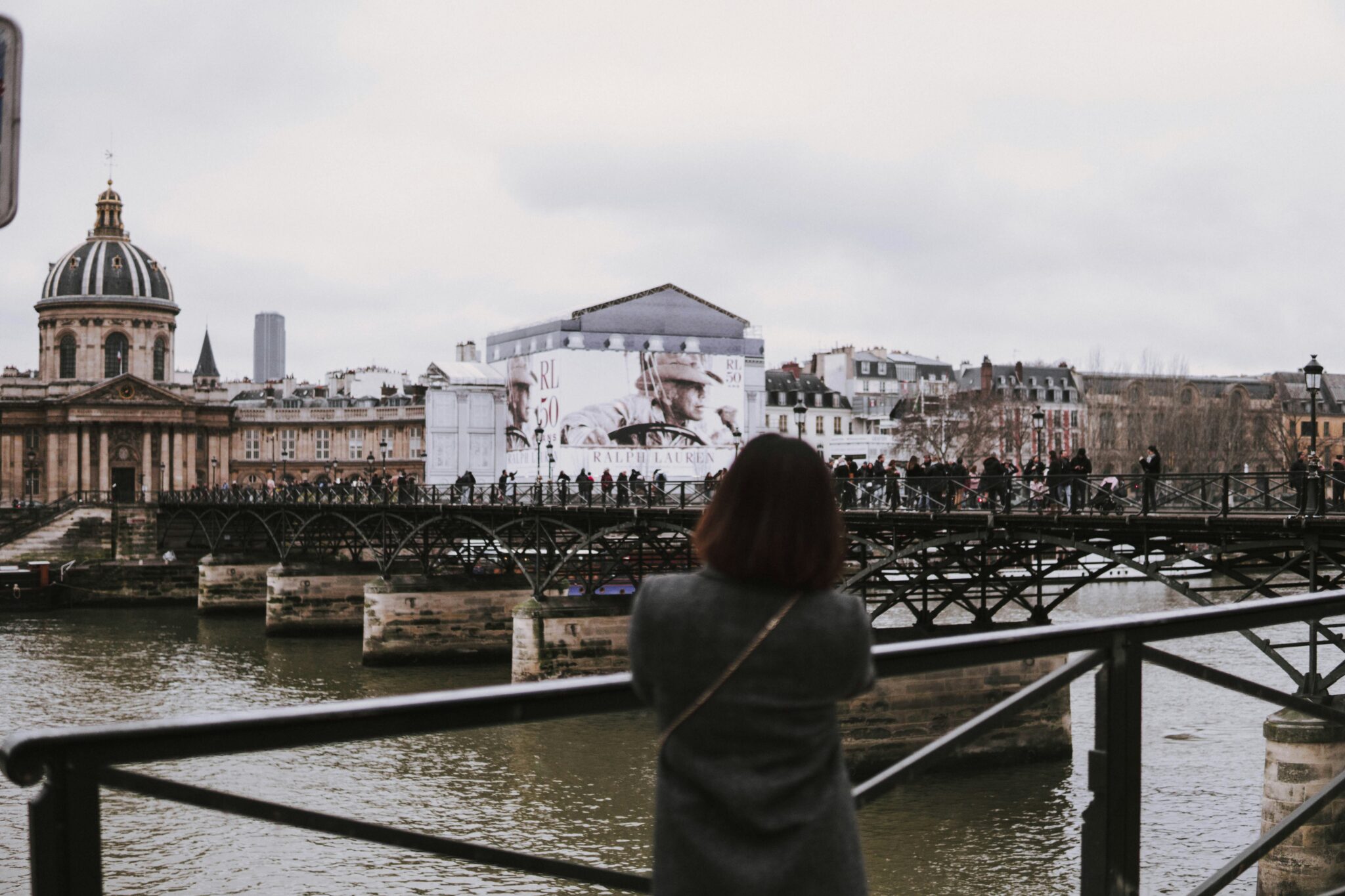 Photo of a woman overlooking a city
