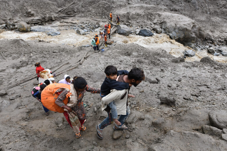 August 15, 2025, Kishtwar, Jammu And Kashmir, India: An Indian Emergency SDRF team evacuates civilians after torrential rain caused deadly mudslides in Kishtwar.