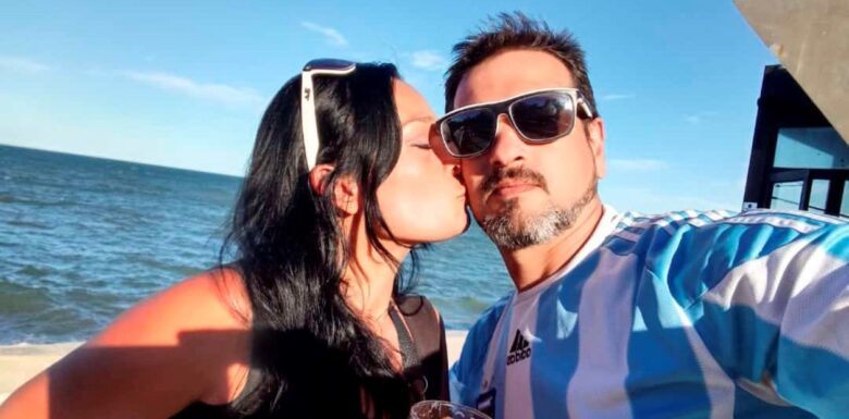 Yamila and Dardo, swingers who specialize in threesomes and “soft swapping,” posing for a selfie.