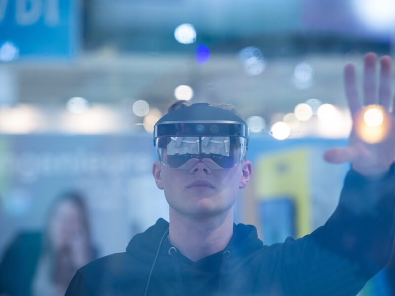 A man looks through augmented reality glasses from Meta and controls a program.
