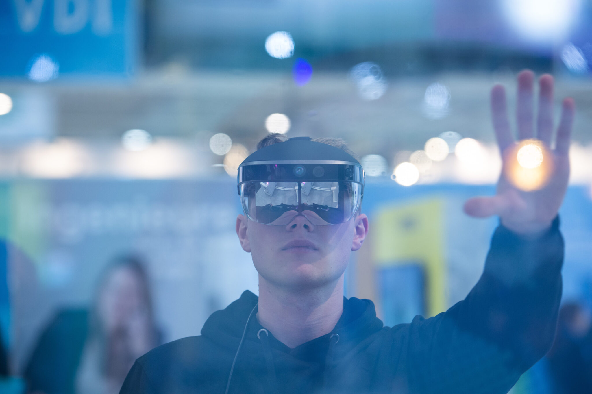 A man looks through augmented reality glasses from Meta and controls a program.