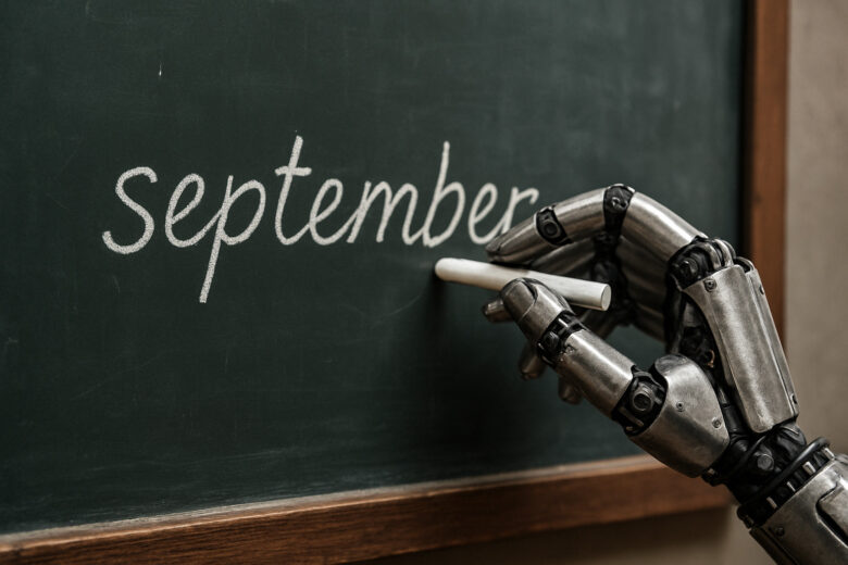 Robot hand writes on a blackboard