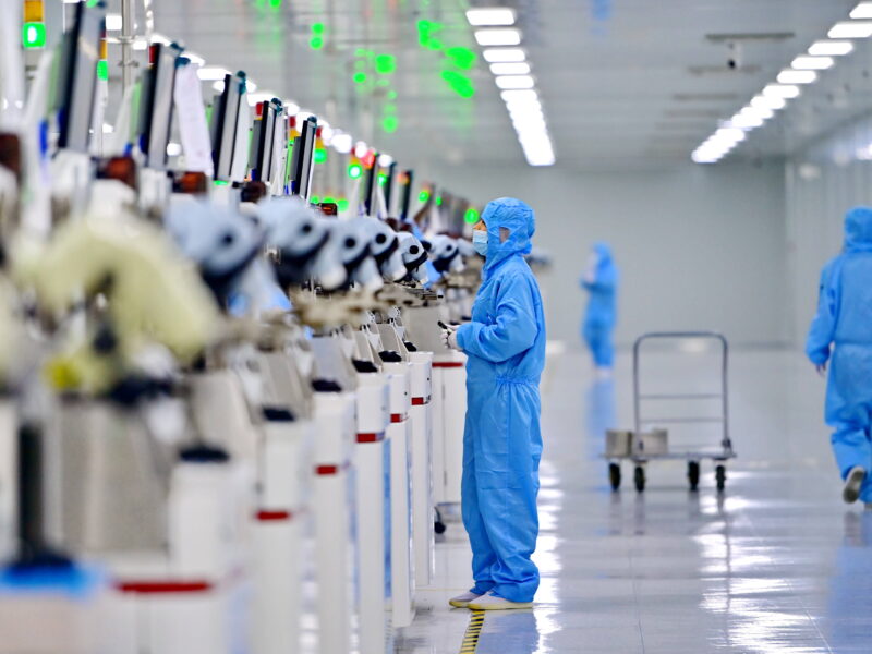 Employees work on a semiconductor production line at a science and technology enterprise in Jiujiang, Jiangxi Province of China.
