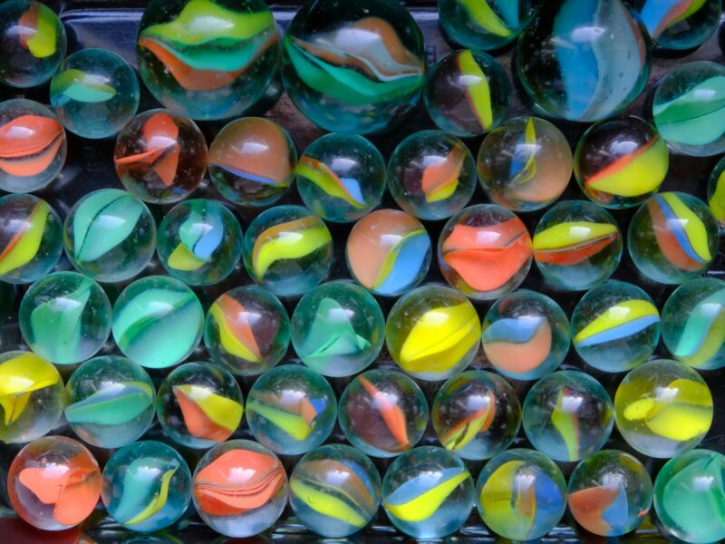 Colourful marbles sitting on a table