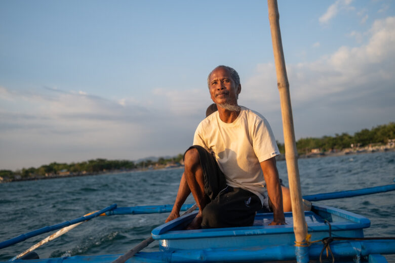 George Cacayuran sails around the municipal fishing grounds to catch squid in Agoo, La Union.