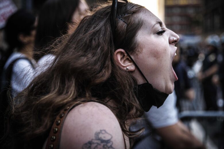 A protester shouting her frustration.