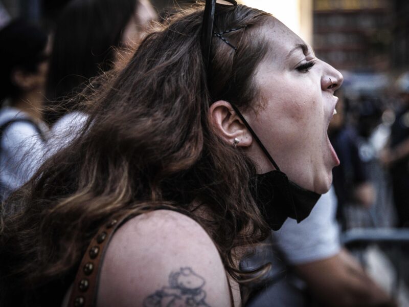 A protester shouting her frustration.