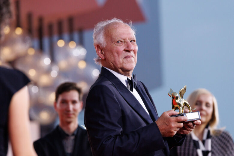 Werner Herzog poses with the Golden Lion at the The 82nd Venice International Film Festival on August 27, 2025 Venice, Italy.
