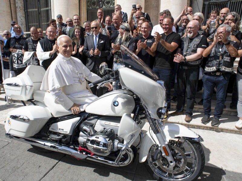 Pope Leo XIV sits on a custom BMW R18 motorbike at the end of the pontiff’s general audience at St. Peter's Square in the Vatican. Once signed, the bike will be auctioned in Munich, with proceeds supporting a children's charity project in Madagascar through Catholic missions of Austria.