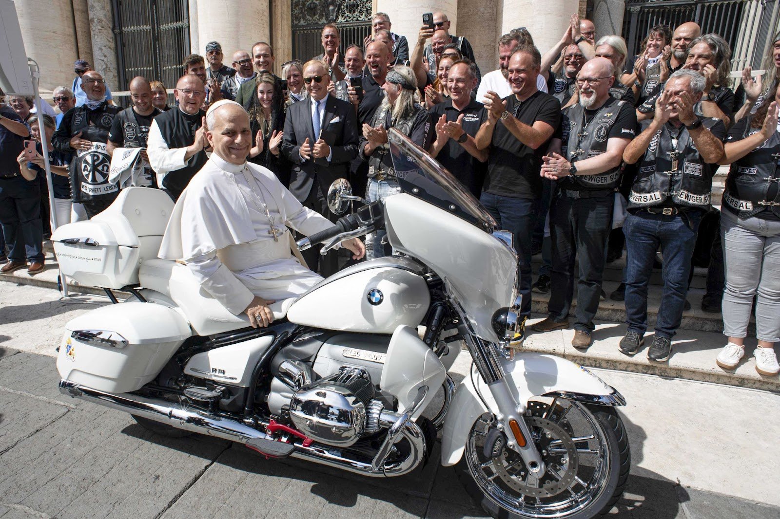Pope Leo XIV sits on a custom BMW R18 motorbike at the end of the pontiff’s general audience at St. Peter's Square in the Vatican. Once signed, the bike will be auctioned in Munich, with proceeds supporting a children's charity project in Madagascar through Catholic missions of Austria.