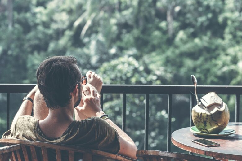 Man relaxing on a balcony