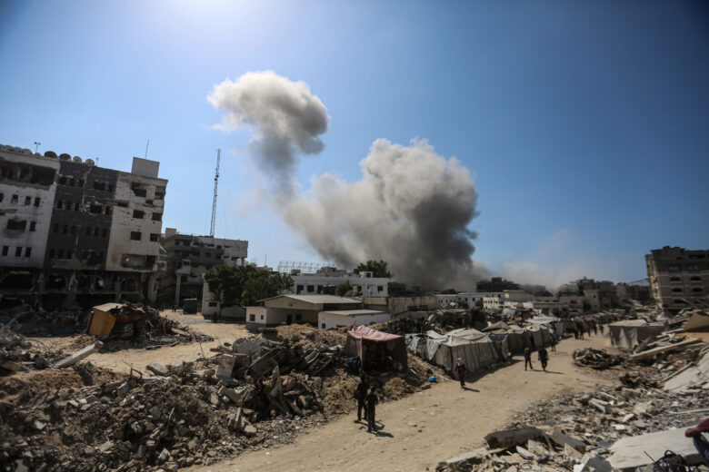 Smoke rises from Al-Ghafri Tower in Gaza City, after it was hit by an Israeli air strike on September 15, 2025