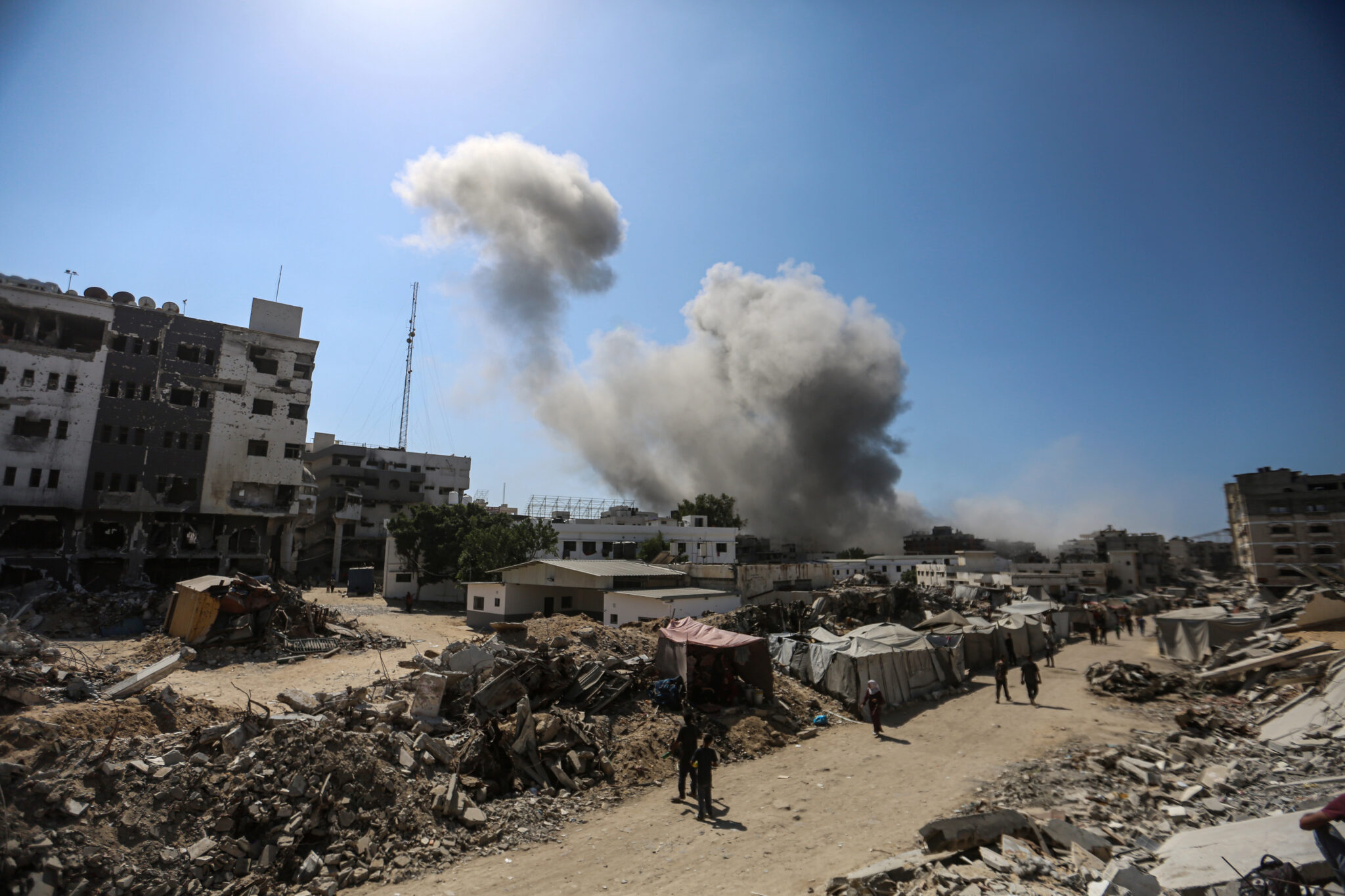 Smoke rises from Al-Ghafri Tower in Gaza City, after it was hit by an Israeli air strike on September 15, 2025