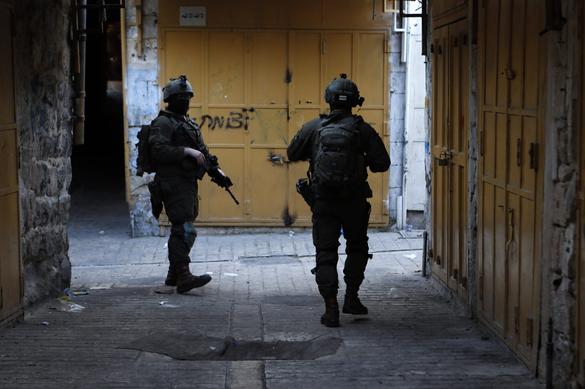 Israeli security forces stand guard as Israeli settlers tour in the Palestinian side of occupied West Bank on September 6, 2025.