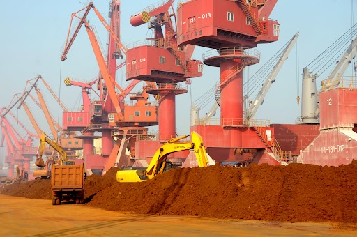 Excavator carries rare earth at Lianyungang dock in Lianyungang, Jiangsu province of China.