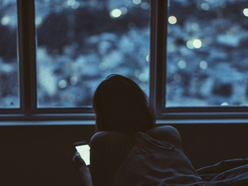 Woman on smartphone in the dark
