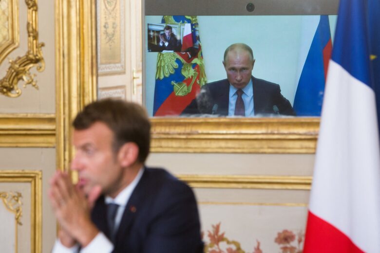 French President Emmanuel Macron talks to Russian President Vladimir Putin during a video conference.
