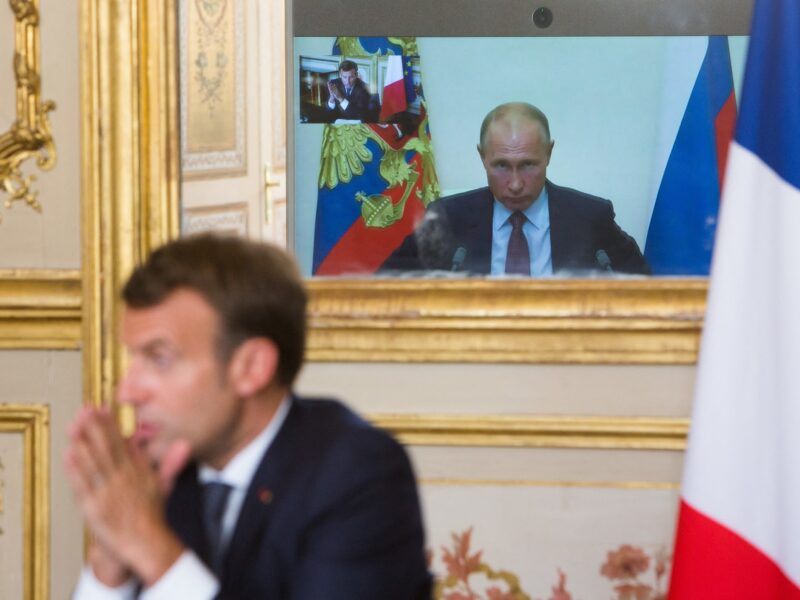 French President Emmanuel Macron talks to Russian President Vladimir Putin during a video conference.