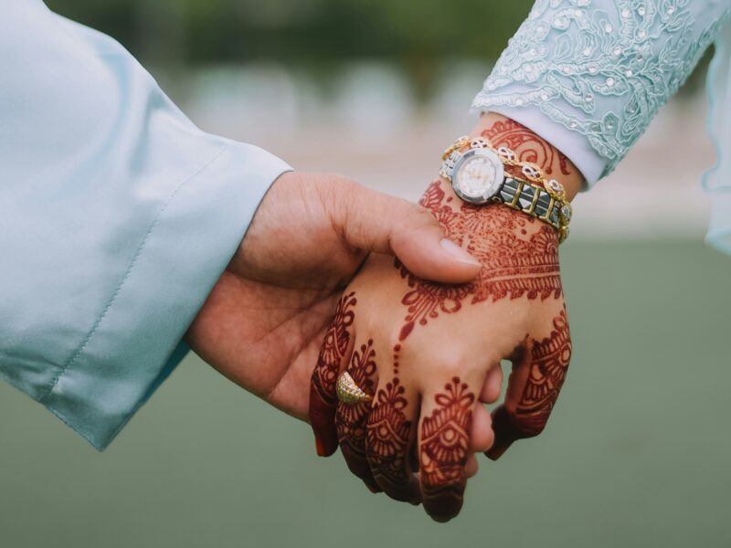 Couple holding hands