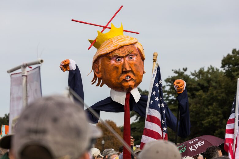 Protesters hold an effigy of US President Donald Trump as part of the No Kings Day protests on October 18, 2025, in Washington, USA.