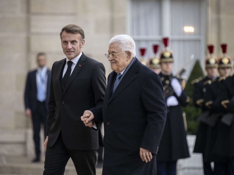 French President Emmanuel Macron welcomes Palestinian president Mahmud Abbas at the Elysee Presidential Palace in Paris on November 11, 2025.