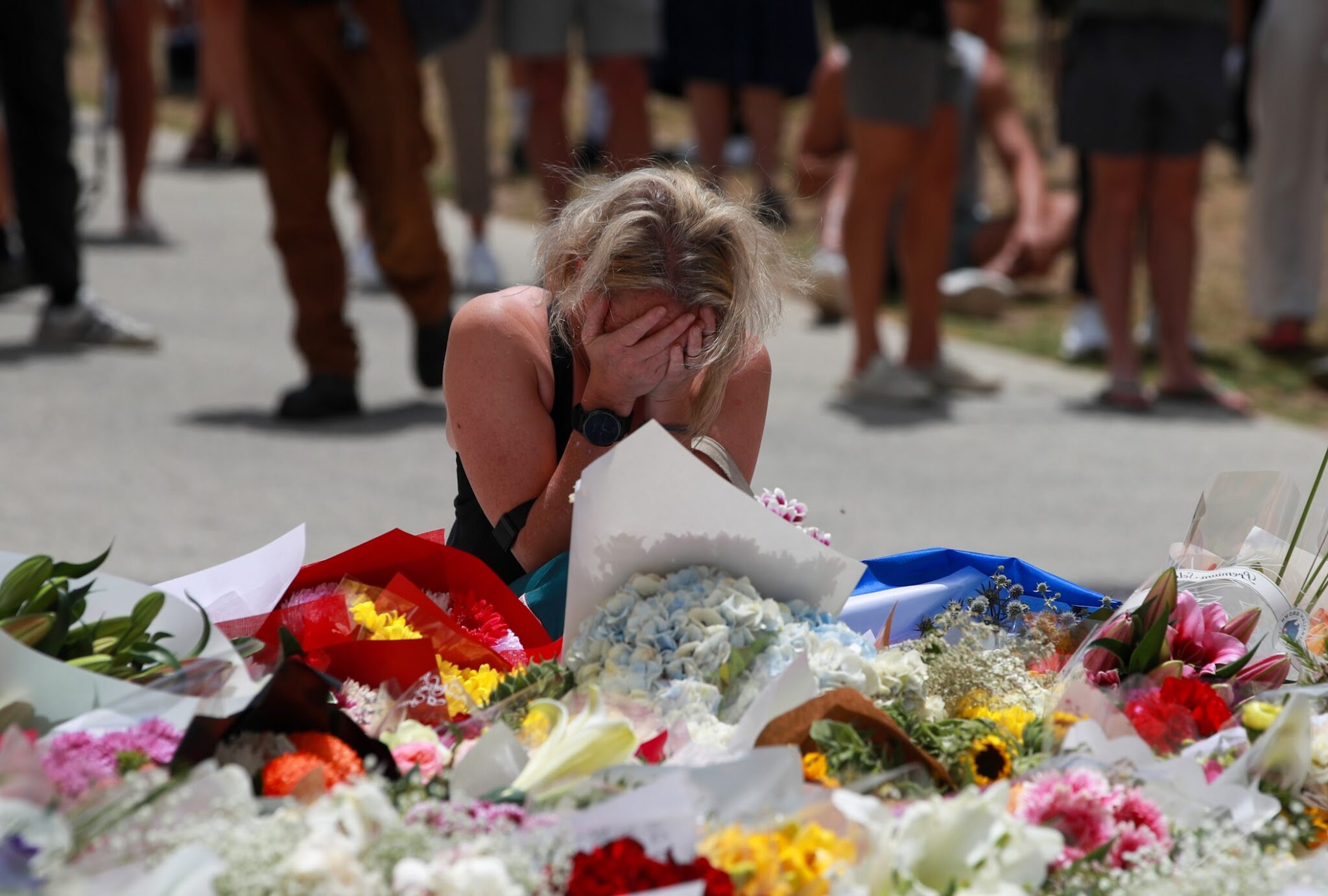 A woman mourns the victims of the Bondi Beach shooting in Sydney, Australia, Dec. 15, 2025.
