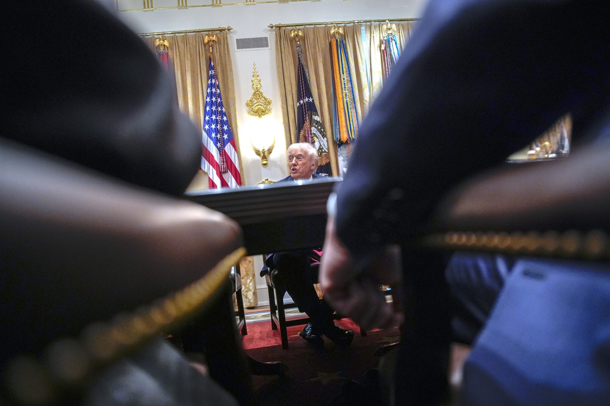 Donald Trump answers reporters questions at a meeting with his Cabinet in the White House in Washington on December 2, 2025