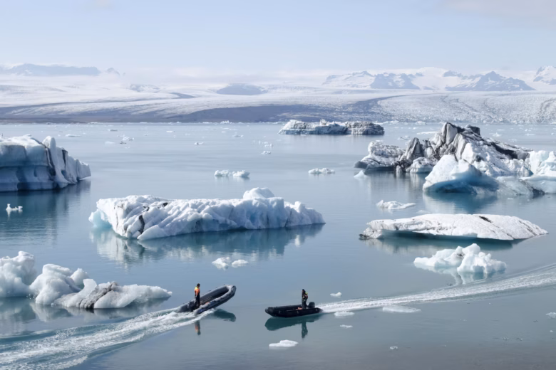 Boats passing off the coast of Iceland.